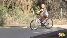 Inked blonde muff diver seduces the wandering cyclist into using a double ended dildo